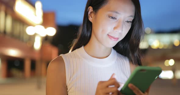 Woman use of cellphone at outdoor