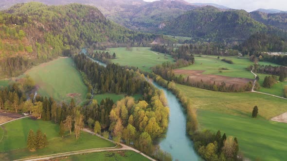 Flying over countryside towards the hills and mountains