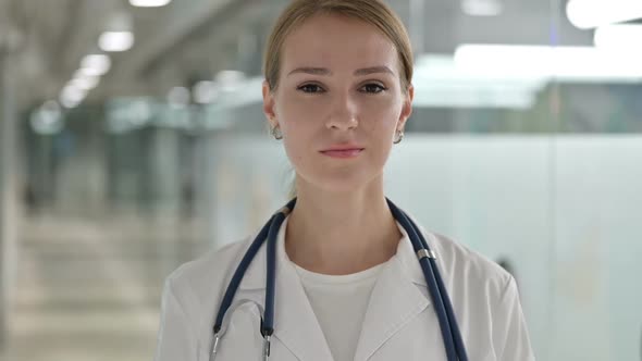 Serious Female Doctor Looking at Camera