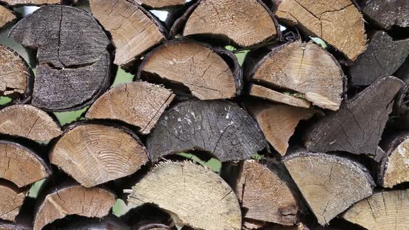 Stack of firewood prepared for winter. Spruce wood.