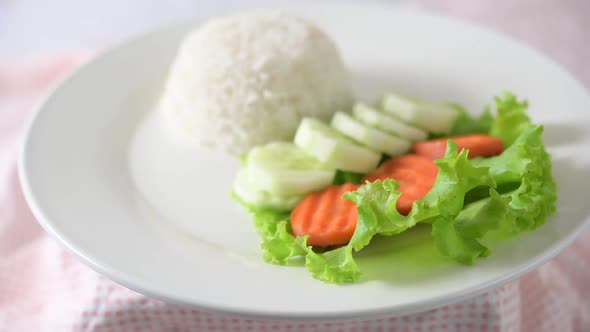 Rice and vegetables on a white plate