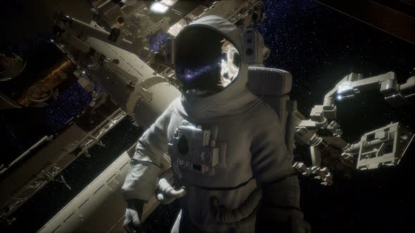 Astronaut Outside the International Space Station on a Spacewalk alt