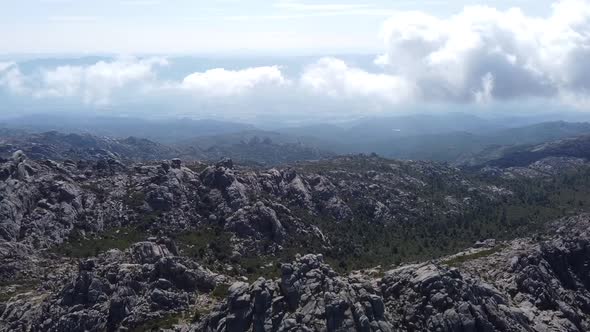 some clouds and fog over sardinias monte limbara, drone flight