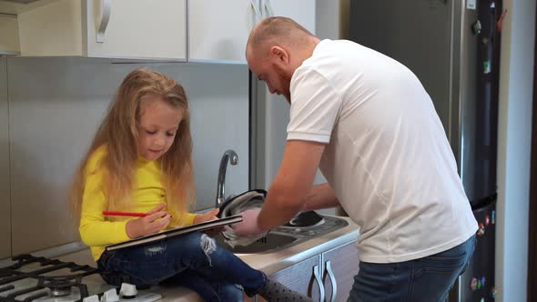 Father Washing Dishes in the Kitchen