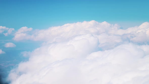 Airplane Flying Through The Beautiful Cloudscape View Through The Airplane Window