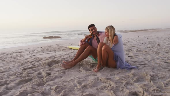 Caucasian couple enjoying time at the beach