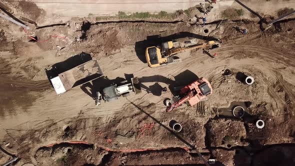 Aerial Construction Site with Machinery, Bulldozer, Excavation.