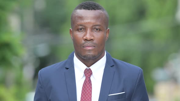 Young Happy African Businessman Wearing Suit Outdoors