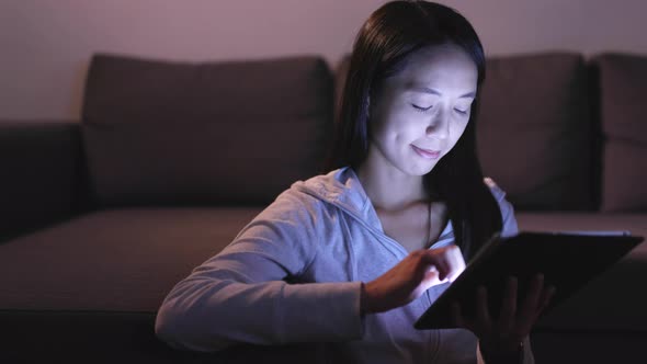 Woman shopping on tablet with credit card 