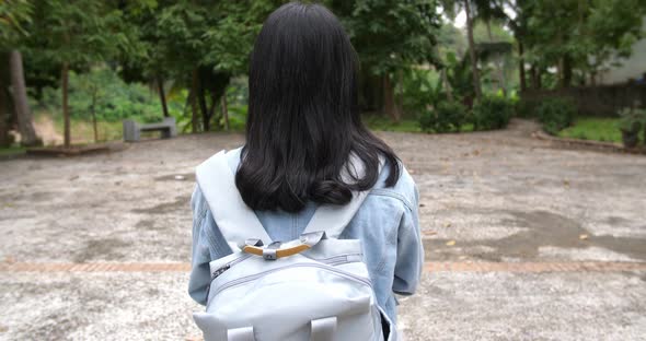 Back Of Asian Woman Student Walking To School