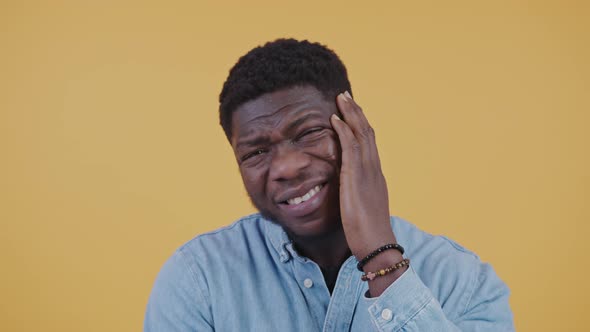 Confused Thoughtful Puzzled Black Guy in His 30s Scratching His Chin and Head Trying to Remember