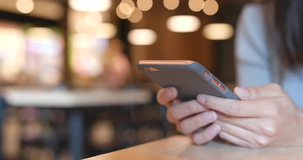 Use of mobile phone in coffee shop 