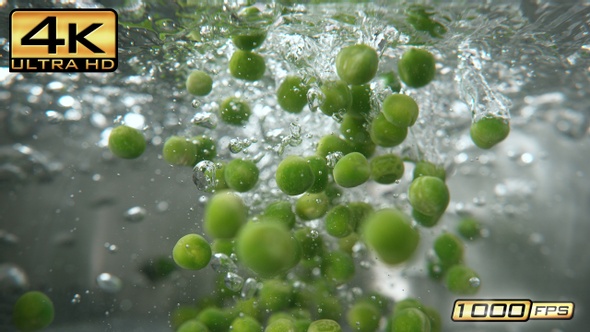 Green Peas Falling into Pot - Underwater View