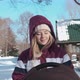 A Young Mother Walks with Her Child in a Stroller on a Clear Winter Day - VideoHive Item for Sale