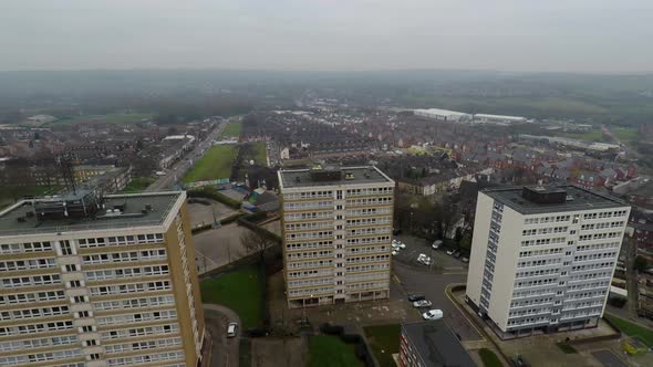 Aerial footage view of high rise tower blocks, flats built in the city of Stoke on Trent to accommod