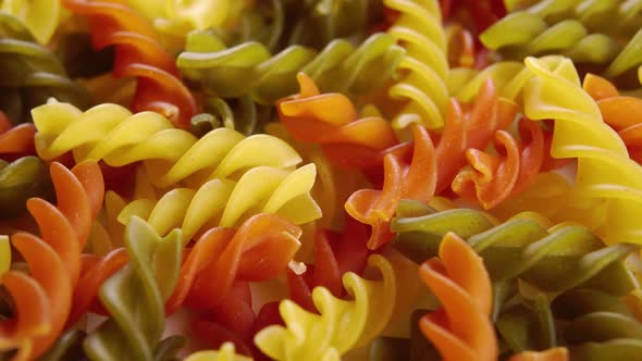 Italian pasta spiral multicolor fusilli. Macro