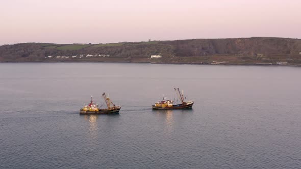 Fishing Trawlers at Sea in the Early Morning Aerial View