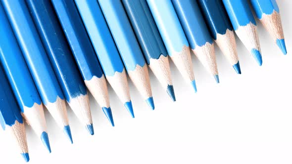 Blue Coloring Pencils on White Background