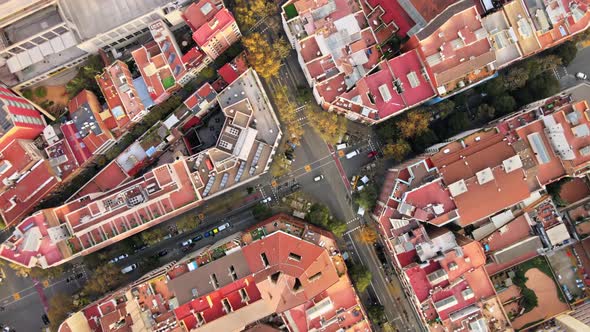 Aerial drone view of Barcelona, Spain. Block with residential buildings, roads with cars