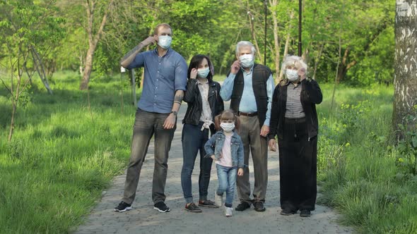 Large Family in Park Takes Off Medical Masks After Coronavirus Quarantine End