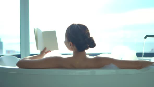 Young asian woman relax in bathtub