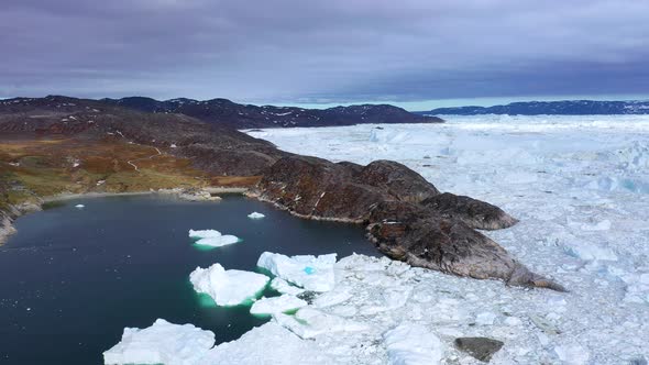 Arctic landscape: mountains, icebergs and glaciers. Climate Change and Global Warming. Ecotourism.