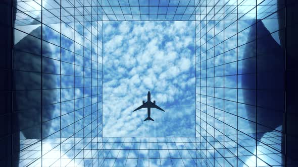 Passenger Plane Flying in the Sky with Clouds Over a Modern Glass Building