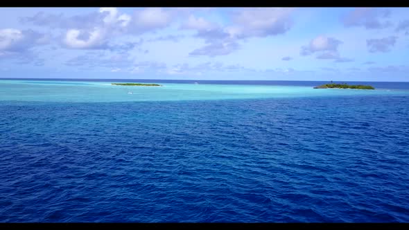 Aerial drone shot seascape of exotic lagoon beach trip by shallow water with clean sandy background 