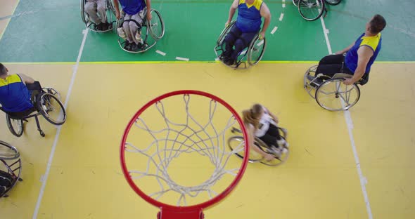 Top View Shot of Persons with Disabilities Playing Basketball in the Modern Hall