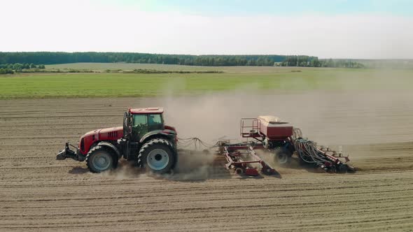 Aerial Sowing of Crops By Tractor with Combined Unit in Dry Weather