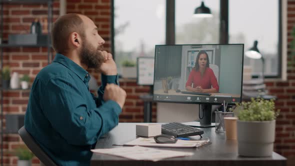 Employee Talking to Manager Using Video Call and Earpods