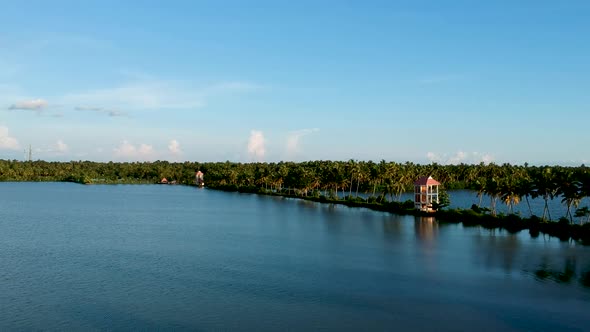 Beautiful sunset,vembanad lake water,coconut trees ,