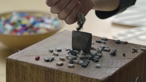 Close Up Shot of a Hand Hammer to Separate Mosaic Tiles