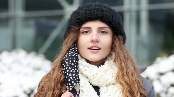 Curly Woman Takes off Medical Mask Breathes Deeply and Smiling Looking at Camera