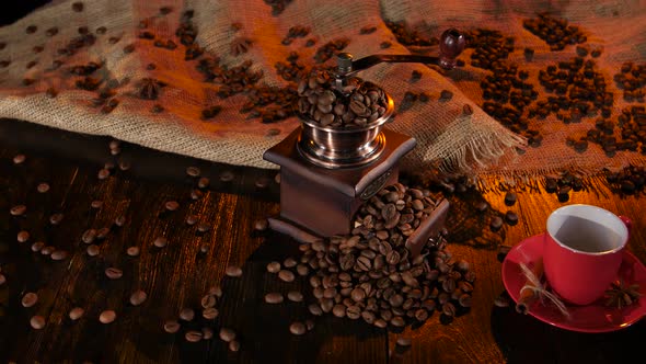 Table with a Coffee Grinder Full of with Coffee Beans