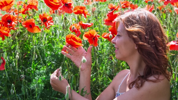 Woman In Poppy Field