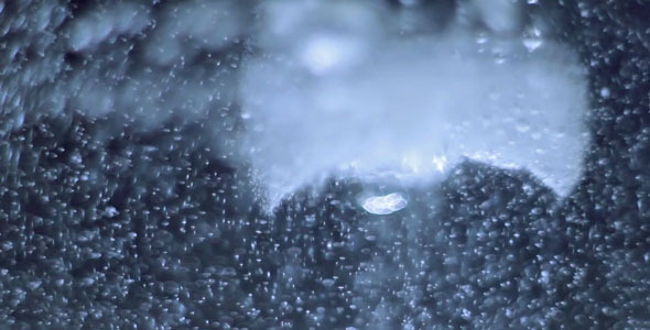 Ice Cube Melting in Hot Water