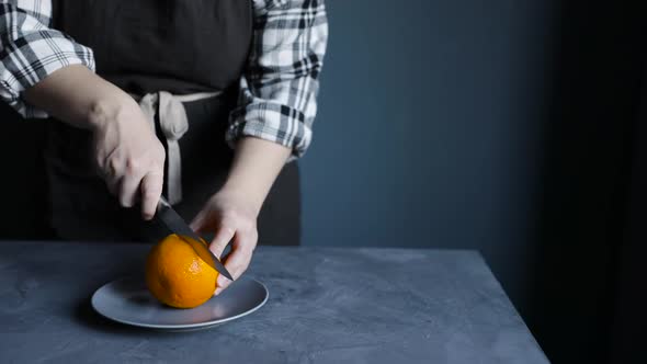 Woman Squeezing Fresh Orange Juice