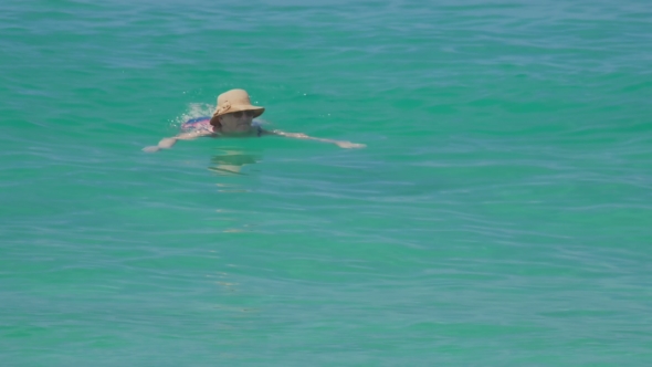 Woman Swimming In The Ocean