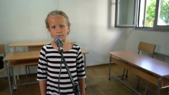 Seven Year Old Girl Practices Vocal