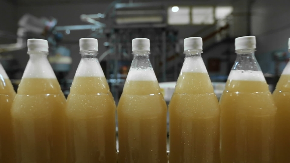 Lemonade In Plastic Bottles On The Conveyor