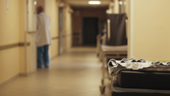 View Corridor In Maternity Hospital. Nurses And Doctors In Medical Uniform. Maternity Home