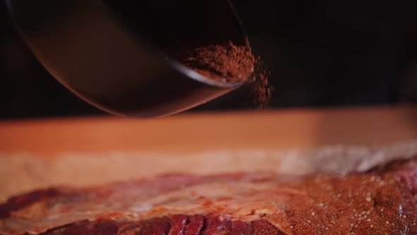 sprinkle raw meat with spices before cooking