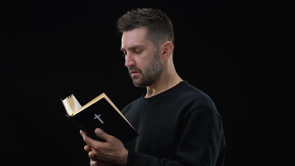 Religious Believer Holding Bible, Finding Answers to Questions, Faith in God