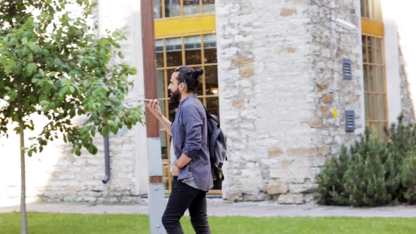 Man With Backpack Calling On Smartphone In City 37