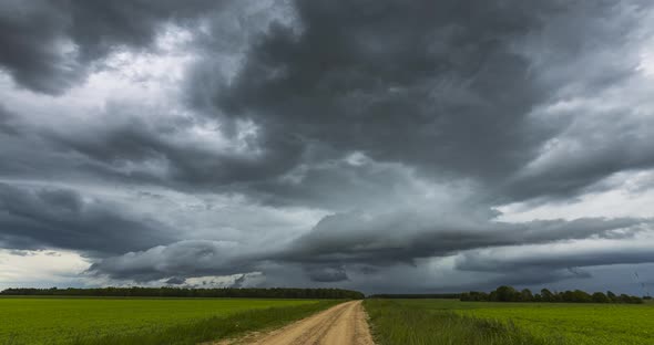 Atmospheric Storm Clouds Fast Moving Over the Ground. Climate Change and Global Warming