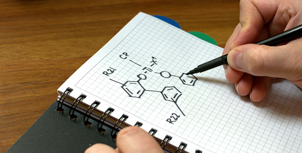 Man Draws a Chemical Formula