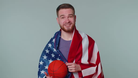 Bearded Young Man Basketball Fan Holding American USA Flag Doing Winner Gesture Dancing Alone