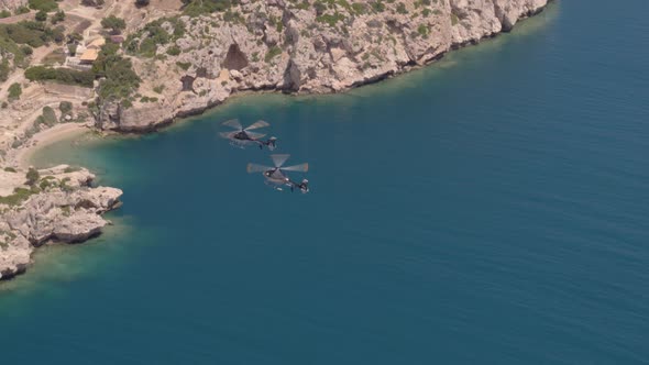 Aerial View of Helicopters Flying Over Ionian Sea Towards Bay and White Cliffs