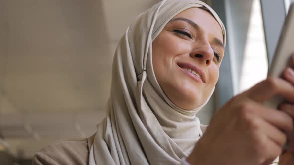 Muslim Woman on Remote Working Online Education or Video Conversation in Caffe